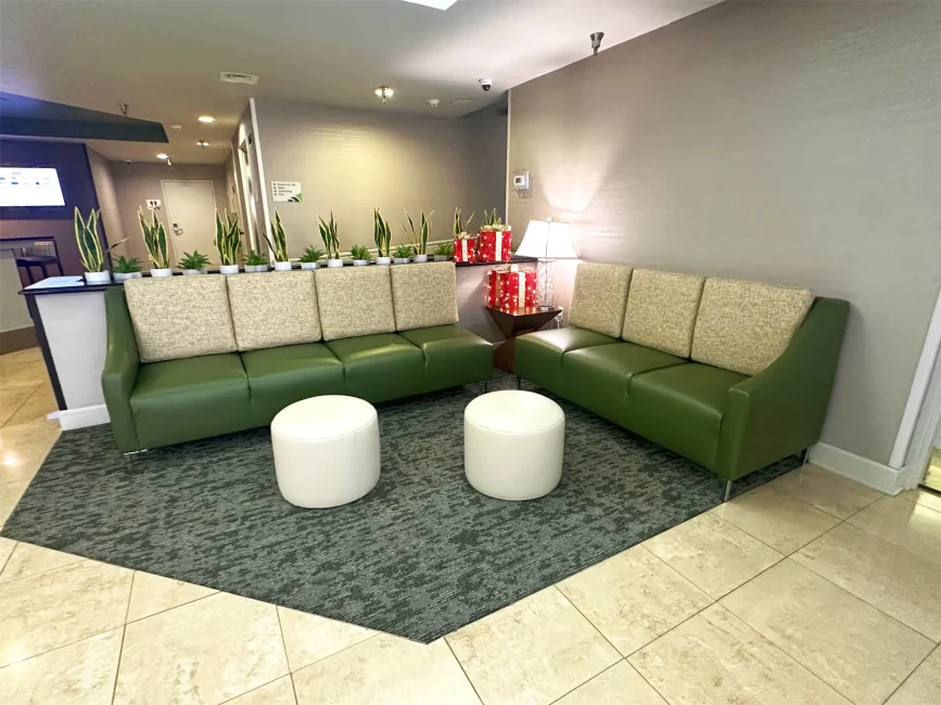 Green Sofa In Lobby with White Ottmans as well 2